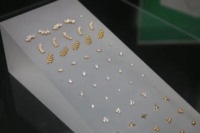 Gold piercing jewellery on the tray